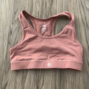 Senita Athletica pink sports bra with iPhone pocket in back. It is a size small.